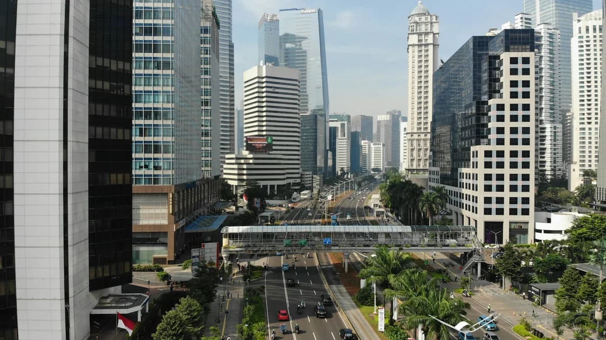 Ilustrasi lalu lintas dan gedung di Jakarta